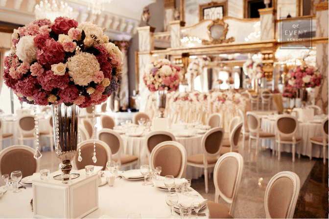 beautiful flower centerpiece with wedding reception decor in background
