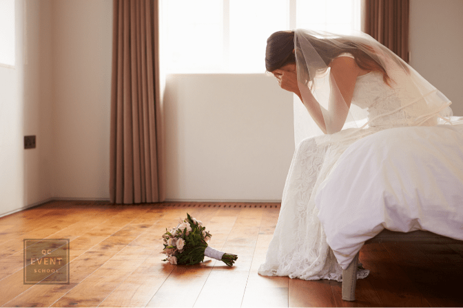 bride sick and sad on the bed, with bouquet on the floor