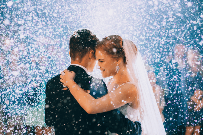 bride and groom first dance, surrounded by confetti