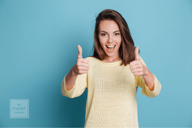 brunette woman giving thumbs up
