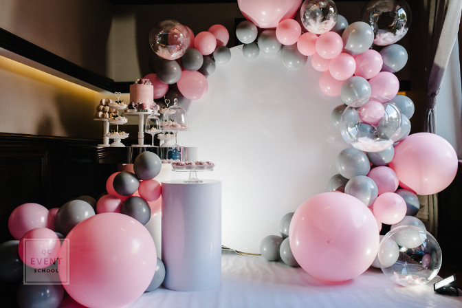 Delicious wedding reception. Birthday Cake on a background balloons party decor. Copy space. Celebration concept. Trendy Cake. Candy bar. Table with sweets, candies, dessert.