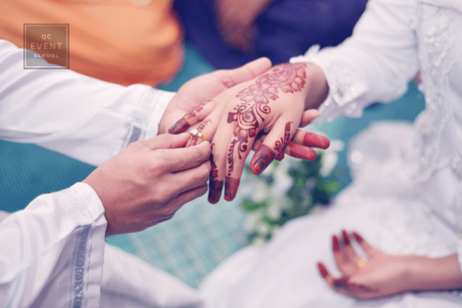 man placing ring on woman's finger during cultural wedding ceremony