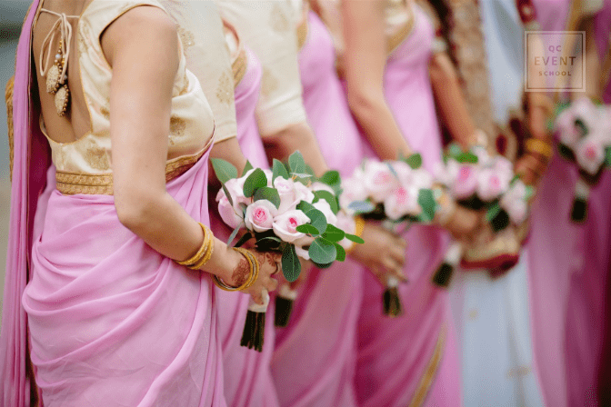 bridesmaids holding bouquets during wedding ceremony