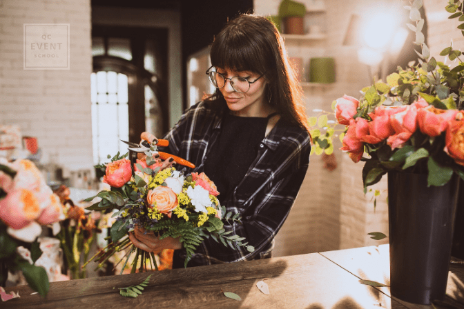 florist working on bouquet in shop